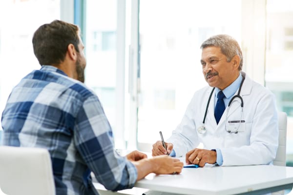 A physician in discussion with a patient at the General Medicine department of Porunai Hospitals.